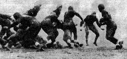 Notre Dame quarterback Frank Carideo carrying against Army in 1930