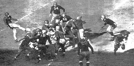 Pittsburgh halfback Marshall Goldberg punting against Fordham in 1936