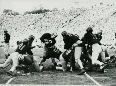 Michigan fullback Jack Weisenbuger scoring a touchdown against Southern Cal in the 1948 Rose Bowl