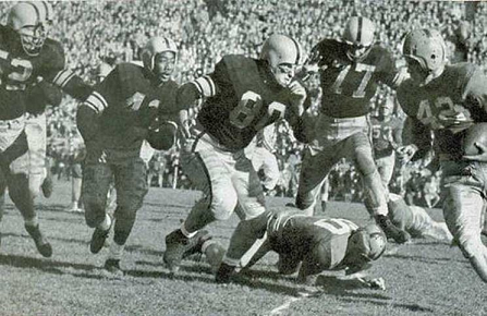 Notre Dame halfback Joe Heap carrying the ball in a 1953 game against Iowa