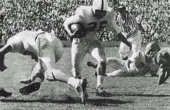 Oklahoma halfback Tommy McDonald carrying the ball against Texas in 1955