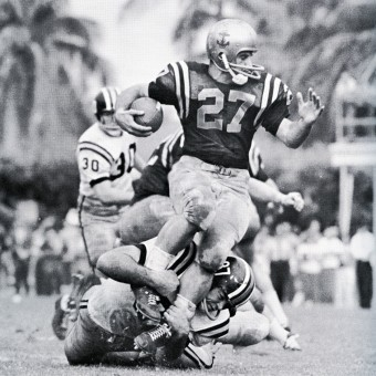 Missouri end Dan LaRose tackling Navy halfback Joe Bellino in the 1961 Orange Bowl