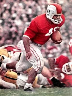 Ohio State fullback Bob Ferguson carrying the ball against Iowa in 1961