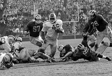 Ohio State fullback Bob Ferguson carrying the ball against Michigan in 1961