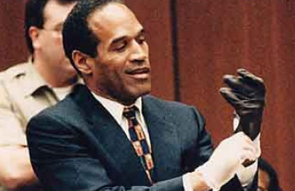 O. J. Simpson trying on the fateful glove at his murder trial