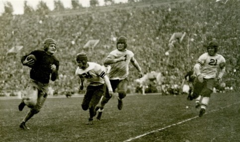 Southern Cal quarterback Don Williams carrying the ball, 1928