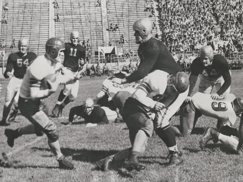 Ohio State quarterback Les Horvath carrying the ball against Iowa in 1944