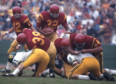 Southern Cal running back O. J. Simpson carrying the ball against Oregon in 1967